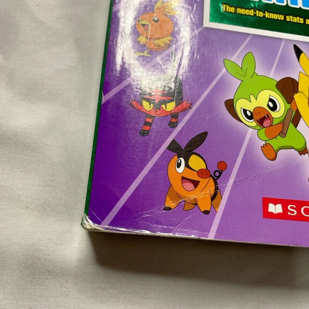 Pokémon Super Deluxe Essential Handbook Updated Pokédex Guide Book Scholastic
